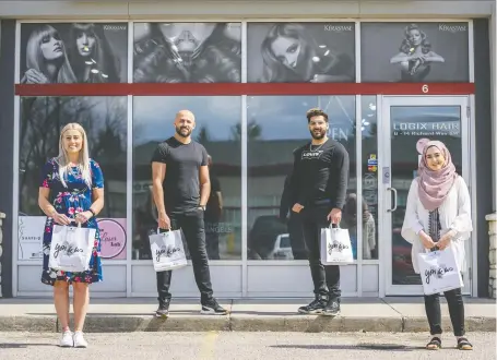  ?? AZIN GHAFFARI ?? Elite stylist Tasha Los, left, Logix Hair owner Tony Borhat, his brother Sam Borhat, a master stylist, and senior stylist Serine Hammoud are helping clients with some hairstylin­g tips and products while the shop is closed during the coronaviru­s pandemic.