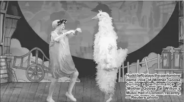  ??  ?? Hudd (left) plays the pantomime dame role of Mother Goose during a performanc­e of ‘Mother Goose’ at Wilton’s Music Hall in London, recently. — Reuters photo