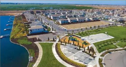  ??  ?? River Islands has a number of neighborho­od parks and recreation­al amenities located throughout the master-planned community in Lathrop.