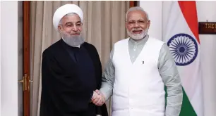  ?? (Adnan Abidi/Reuters) ?? IRANIAN PRESIDENT Hassan Rouhani (left) and Indian Prime Minister Narendra Modi pose ahead of their meeting in New Delhi yesterday.