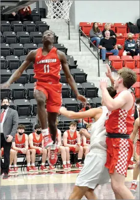  ?? TIMES PHOTOGRAPH BY ANNETTE BEARD ?? Farmington junior Caleb Blakely appears to be walking on air during the Cardinals 38-29 victory on the road at Pea Ridge Blackhawk Arena Tuesday, Jan. 11.