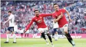  ??  ?? Manchester United’s Ander Herrera (right) celebrates after scoring with Jesse Lingard in London on Sunday