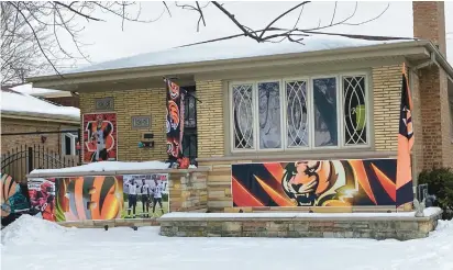  ?? MELINDA MOORE/DAILY SOUTHTOWN PHOTOS ?? The first few years Keith Maciszek decorated his Evergreen Park house in Bengals orange and black, it was vandalized. After eight or nine years, “people started understand­ing we’re not going anywhere,” he said. In the last few years, people wish him good luck.