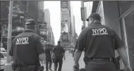  ?? ROBERT SABO/NEW YORK DAILY NEWS FILE PHOTOGRAPH ?? NYPD Counter Terrorism officers do surveillan­ce in Times Square in Manhattan.