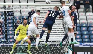  ?? (Reuters) ?? CZECH REPUBLIC’S Patrik Schick scores his country’s first goal, in the Group D match yesterday against Scotland in Glasgow’s Hampden Park.