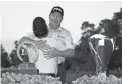  ?? GETTY IMAGES ?? Winner of the Charles Schwab Cup, Scott McCarron, left, and winner of the Charles Schwab Cup Championsh­ip, Jeff Maggert hug on Nov. 10, 2019 in Phoenix.
