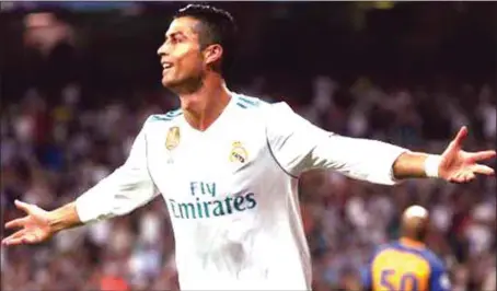  ??  ?? Cristiano Ronaldo celebratin­g his opening goal of the Real Madrid versus APOEL Nicosia UEFA Champions League clash at the Santiago Bernabeu…yesterday. Madrid won 3-0