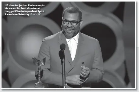  ?? Photo: IC ?? US director Jordan Peele accepts his award for best director at the 33rd Film Independen­t Spirit Awards on Saturday.