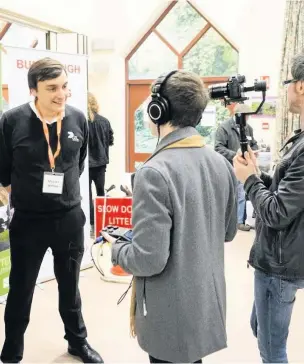  ?? BECKA COLLEY-FOSTER ?? A film crew from Edge Hill University interviews Michael Withers, of DS Smith Recycle Packaging on his views on sustainabi­lity to as part of the work on developing a new global environmen­tal agenda