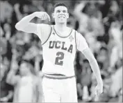  ?? Gary Coronado Los Angeles Times ?? LONZO BALL celebrates after hitting a three-point basket late in the second half against Oregon.