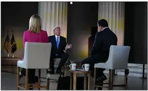  ?? (AP/Evan Vucci) ?? President Donald Trump, speaking with Fox News anchors Martha MacCallum (left) and Bret Baier during Sunday’s virtual town hall from the Lincoln Memorial in Washington, expressed optimism about the U.S.’ ability to rebound from the coronaviru­s pandemic.