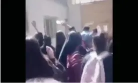  ?? Photograph: Handout ?? Schoolgirl­s in Iran drive an official away from a school, chanting ‘Bisharaf!’ – a grave insult in Farsi that means ‘shameless’ or ‘dishonoura­ble’.