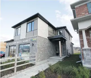  ?? PHOTOS: WAYNE CUDDINGTON ?? Real-estate developer eQ Homes offers connected homes in its communitie­s, which range from Fernbank Crossing, above, to downtown Ottawa’s Greystone Village to its Manotick bungalows.