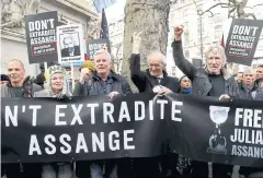  ?? REUTERS ?? Singer Roger Waters, far right, attends a protest against the extraditio­n of Julian Assange outside the Australian High Commission in London on Saturday.