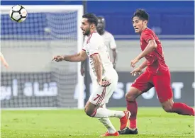  ??  ?? The UAE’s Ali Mabkhout, left, in action against Indonesia.