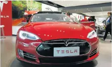  ?? Picture: GETTY IMAGES ?? IN CHARGE: Tesla Motors is building a battery plant in Nevada expected to be turning out half a million electric dodgems by 2018