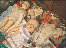  ??  ?? Antique dolls are displayed in a child’s bedroom on the second floor of the Taille de Noyer.
