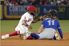  ?? ?? The Blue Jays’ Bo Bichette, right, is tagged out by Luis Rengifo while trying to steal second base during the sixth inning of Thursday night’s series opener.