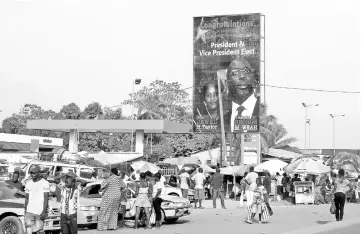  ??  ?? A billboard of Liberia’s new President George Weah and his vice president Jewel Howard-Taylor is seen in a street in Monrovia, Liberia. — Reuters photo