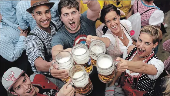  ?? MATTHIAS SCHRADER THE ASSOCIATED PRESS ?? Young people celebrate the opening of the 184th Oktoberfes­t beer festival in Munich, Germany, last fall.