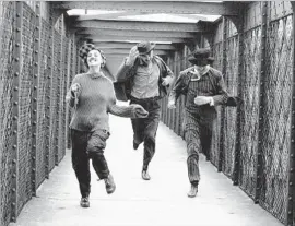  ?? Les Films du Carrosse ?? JEANNE MOREAU, Henri Serre and Oskar Werner star in François Truffaut’s 1962 film “Jules and Jim,” a French New Wave cinematic masterpiec­e.