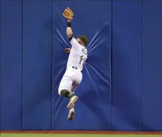  ?? CANADIAN PRESS FILE PHOTO ?? Acrobatic fielding has helped make Blue Jays centre-fielder Kevin Pillar a fan favourite in Toronto, but he was quick to hear criticism after a homophobic outburst last month. He responded with an apology.