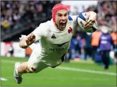  ?? Photo: AFP ?? Gabin Villiere dives across the line to score a try in France’s 37-10 Six Nations win against Italy last Sunday (Feb 5).