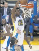  ?? NHAT V. MEYER — STAFF PHOTOGRAPH­ER ?? Warriors center Damian Jones dunks for two of his 12 points on 6-of-7 shooting Tuesday night against Oklahoma City.