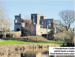  ??  ?? > Powderham Castle which hosts a major food festival every year