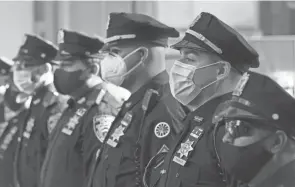  ?? MARK LENNIHAN/AP FILE ?? New York’s vaccine mandate comes amid new uproar over NYPD officers defying even simple measures, like wearing face masks.