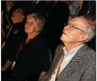  ?? AP/NASA/GLENN BENSON ?? Eugene Parker (front right), a pioneer in heliophysi­cs, watches the launch of the Delta IV rocket, carrying the Parker Solar Probe, at the Kennedy Space Center on Sunday, in Cape Canaveral, Fla.