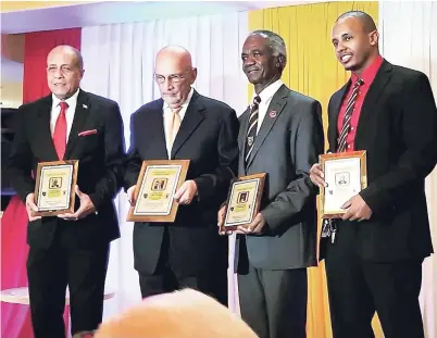  ??  ?? The late Walt Crooks (second left), sharing the spotlight with from left: Former Cornwall College Cornwall College recipients Ali McNab, Senator Noel Sloley and Dr Dwayne Hall, who were all recognised by the school’s alumni associatio­n last October.