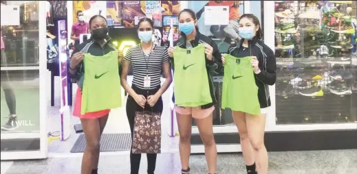  ??  ?? Members of the Guyana Women’s Hockey Team displaying their training vests donated by MVP Sports to be worn at the Indoor Pan Am Cup (IPAC) in the USA