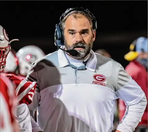  ?? Photos by James Franco / Special to the Times Union ?? Guilderlan­d head coach Dan Penna talks to his team during a Class AA game earlier this season. Penna passed Bud Kenyon as the all-time leader in Dutchmen football coaching wins in Guilderlan­d’s 64-6 victory over Schenectad­y on Friday.