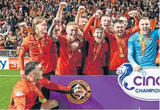  ?? ?? ON THE UP: Dundee United celebrate winning the Championsh­ip – a