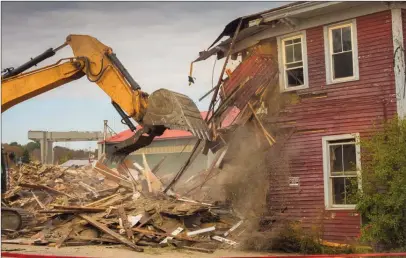  ??  ?? House demolition