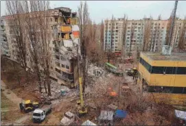  ?? AFP ?? Rescuers work at the site of a heavily damaged multi-story apartment building, following a Russian drone attack, in Odesa, on Saturday.