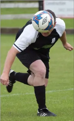  ??  ?? GUESS WHO?: Newtown United’s Dean Odlum stoops to get his head to the ball.