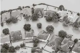  ?? Brett Coomer / Houston Chronicle ?? Floodwater­s from the Addicks Reservoir inundate a neighborho­od off North Eldridge Parkway in the aftermath of Tropical Storm Harvey.