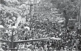  ??  ?? Protesters rally against the military, marching towards the Sule Pagoda in Yangon on Sunday