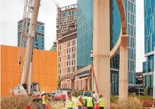  ?? Bloomberg ?? Workers at a constructi­on site in Riyadh. Saudi Arabia is projected to contract by 5.4 per cent this year, and move back into a positive of 3.1 per cent in 2021, the IMF says.