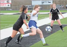  ?? Scott Herpst ?? Ringgold’s Scottie Parton tries to shield the ball from Ridgeland’s Michelle Thomason (left) as Ridgeland defender Emalee Harris looks. The two teams played to a 1-1 tie last Tuesday.