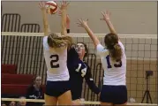  ?? AUSTIN HERTZOG – MEDIANEWS GROUP ?? Villa Maria’s Katie Scaggs (14) tips the ball past Pope John Paul II’s Heather Lesinski and Haley Spotts for a point.