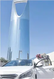  ?? AFP ?? A driver for ride-hailing company Uber Technologi­es Inc gets into his car as he starts his day in Riyadh.