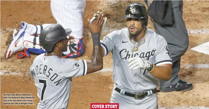  ?? AP ?? The Sox’ Jose Abreu celebrates with Tim Anderson after hitting the first of his two home runs Friday against the Cubs at Wrigley Field.