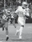  ??  ?? Raiders receiver Amari Cooper sprints past Chiefs cornerback Eric Murray to score a touchdown Thursday.