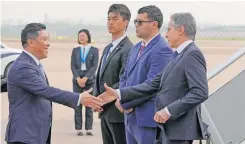  ?? | AFP ?? US SECRETARY of State Antony Blinken is greeted by Kong Fuan, the director-general of the Shanghai Foreign Affairs Office, on his arrival in Shanghai yesterday.