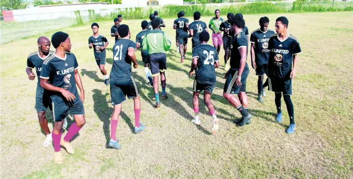  ?? GLADSTONE TAYLOR PHOTOS ?? Members of Falmouth United Football team train at the team’s home field, the Elletson Wakeland Centre in Falmouth, Trelawny, on Wednesday.