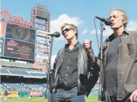  ?? Denver Post file ?? The Bacon Brothers sing the national anthem before a Philadelph­ia Phillies game in 2009.
