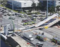  ?? AP PHOTO ?? Emergency personnel respond after a brand-new pedestrian bridge collapsed onto a highway at Florida Internatio­nal University in Miami on Thursday. The pedestrian bridge collapsed onto the highway crushing multiple vehicles and killing several people.